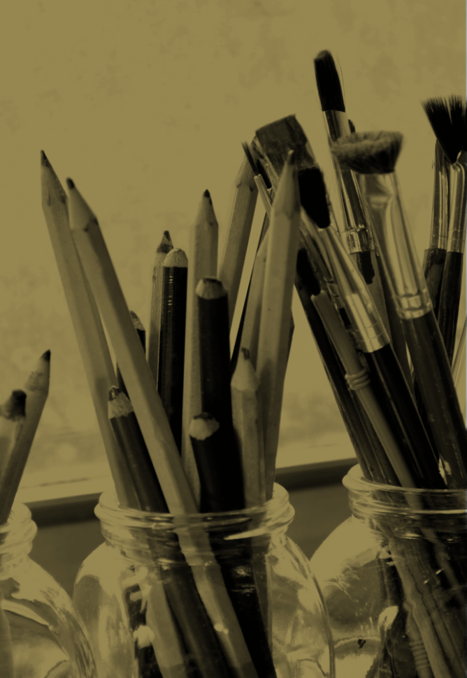 Paintbrushes and pencils symbolizing creativity and craftsmanship at The Blondes branding and design agency